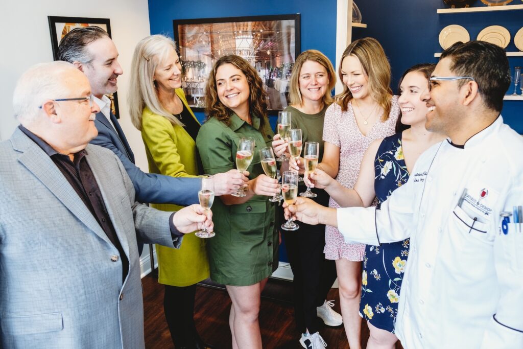 Staff Celebrating Catered By Design Team